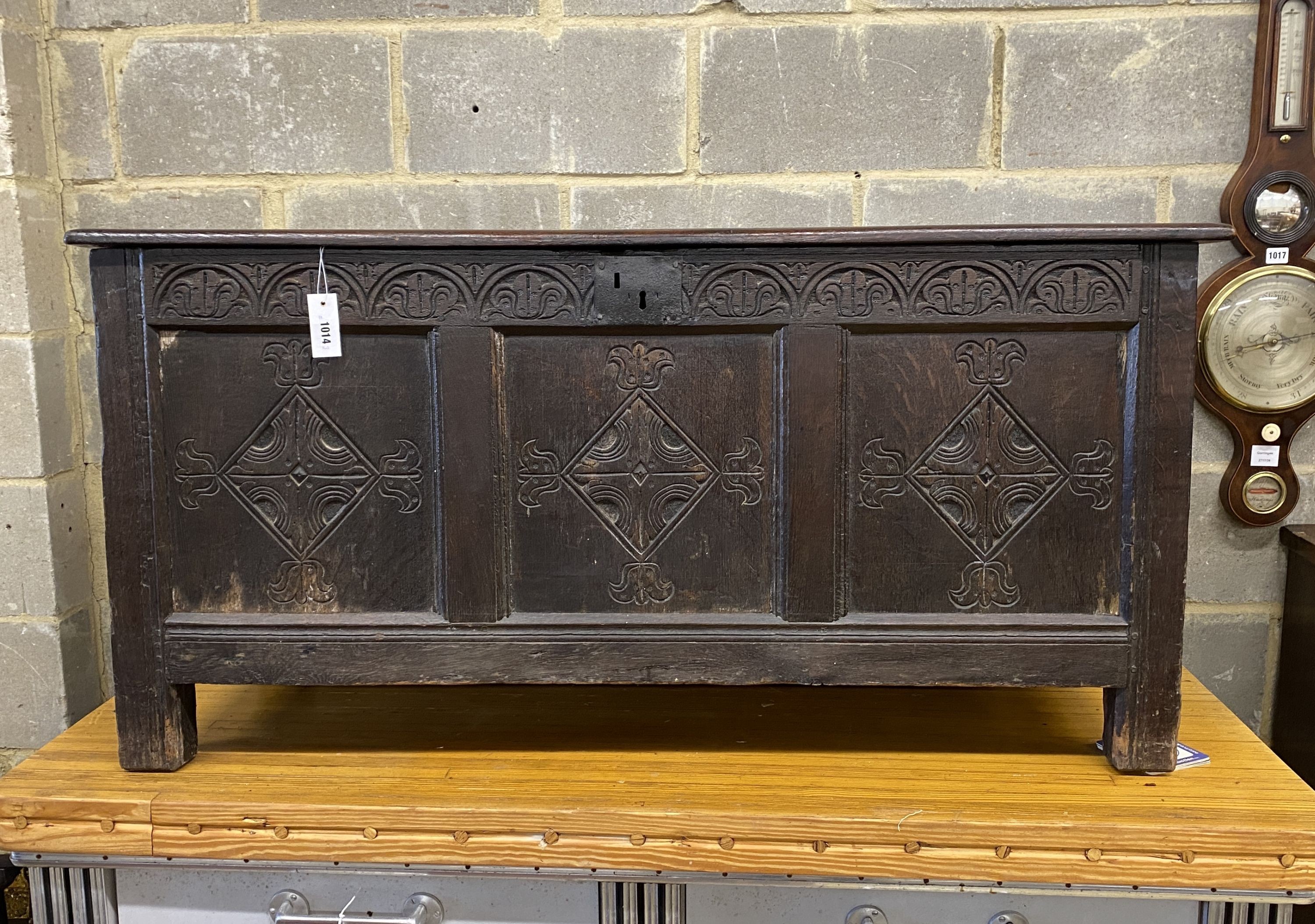 An 18th century and later carved oak coffer, length 130cm, depth 53cm, height 62cm